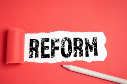 A graphic depicting the word 'reform' on torn paper represents changes in the vet sector.