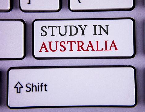 A keyboard key shows 'Study in Australia', reflecting concerns about international student return to Australia during the.