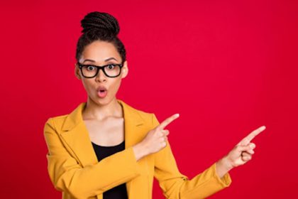 A business professional expresses surprise and enthusiasm during a training session about effective feedback.