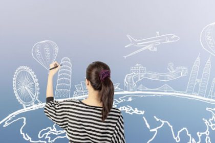 A woman illustrates a world map with landmarks, representing reasonable adjustments for international students in VET.