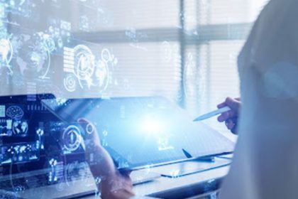A scientist reviews data analysis using a digital tablet and holographic projections for vet training.