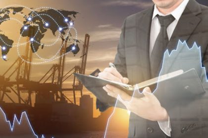 A businessman reviews financial data and logistics, reflecting the need for current vet sector training.