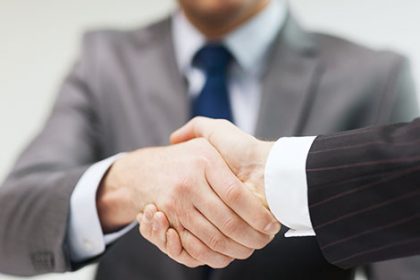 Business people shake hands, representing new appointments in the vet sector.
